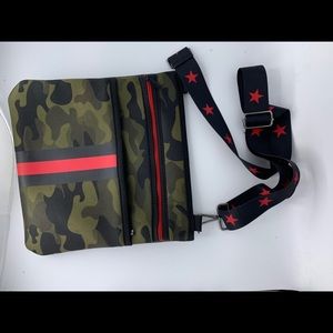 Neoprene Haute Shore crossbody bag. Great condition. Camo and striped design.